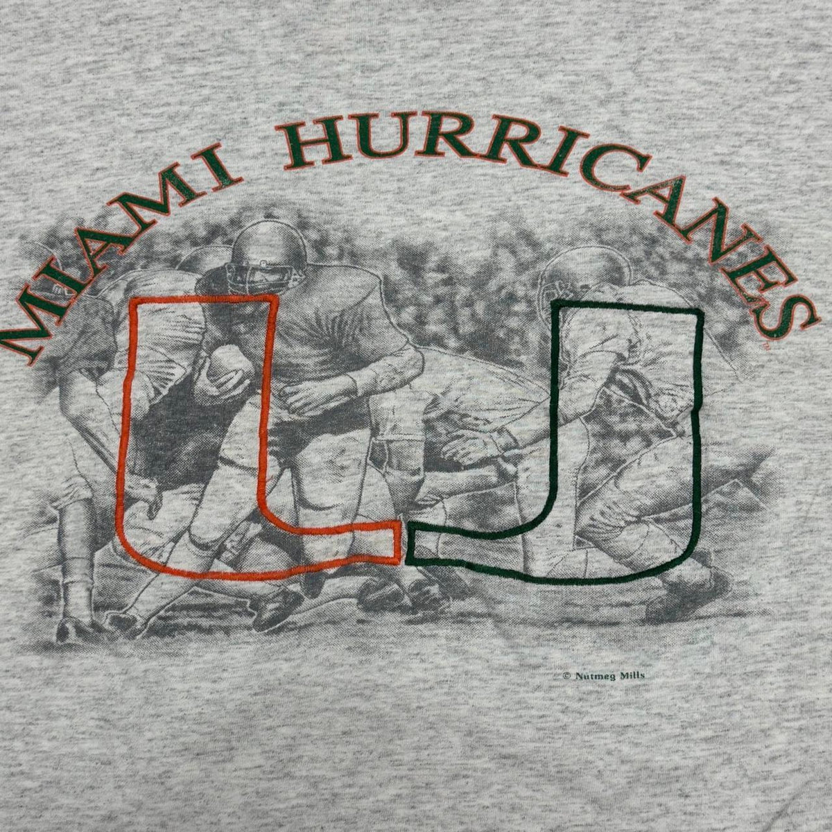 VINTAGE 90S SINGLE STITCH NUTMEG UNIVERSITY OF MIAMI ACTION SHOT EMBROIDERED TEE: