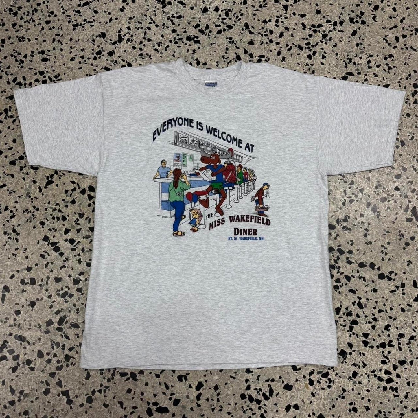 VINTAGE 90S 1999 EVERYONE IS WELCOME AT THE MISS WAKEFIELD DINER MOOSE TEE: