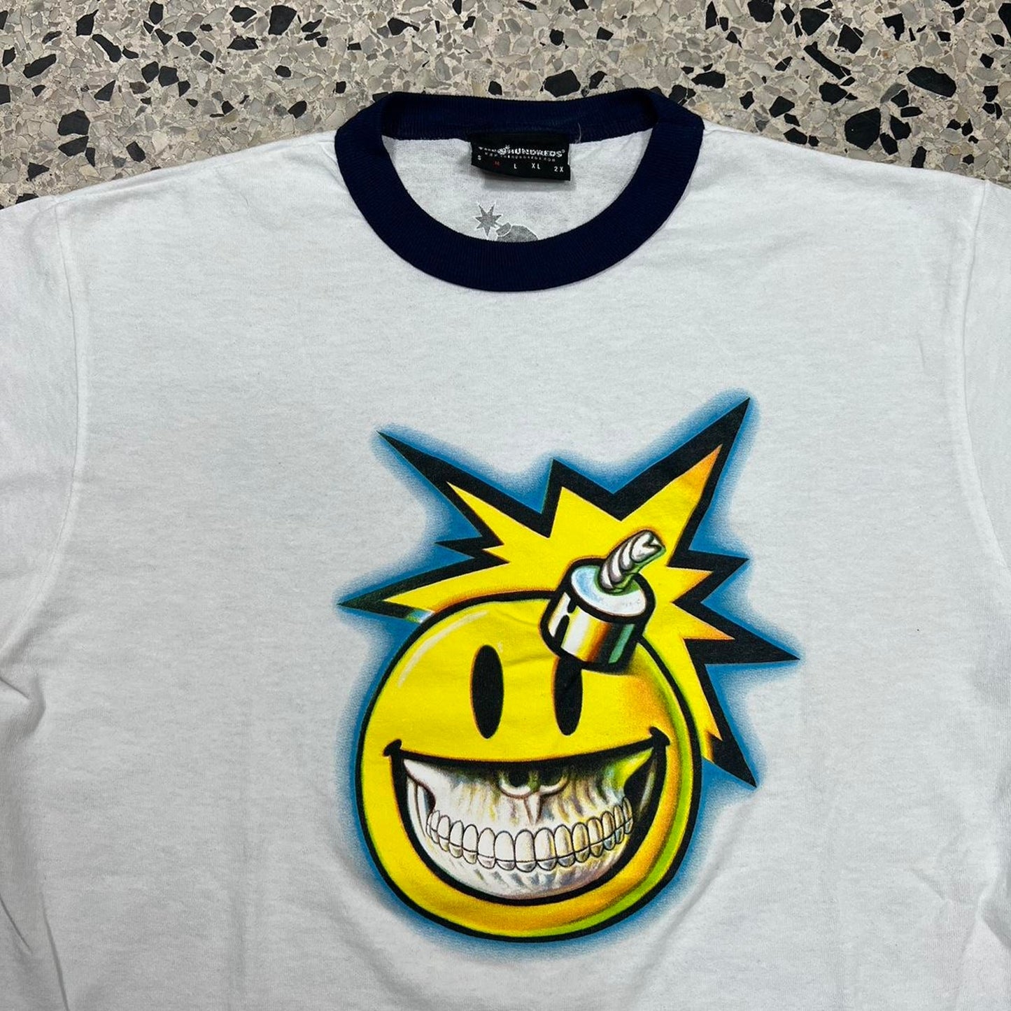 THE HUNDREDS X RON ENGLISH COLLAB SMILEY FACE RINGER TEE: