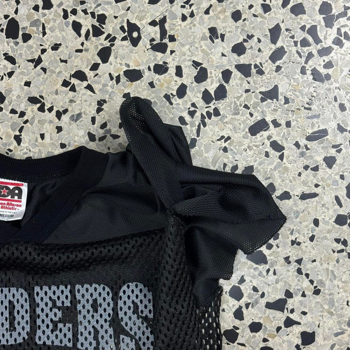 VINTAGE 90S Y2K RAIDERS FOOTBALL MESH SLEEVELESS JERSEY: